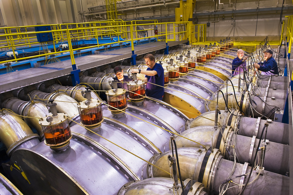 Technicians servicing pulsed-power accelerator hardware at Sandia National Laboratories